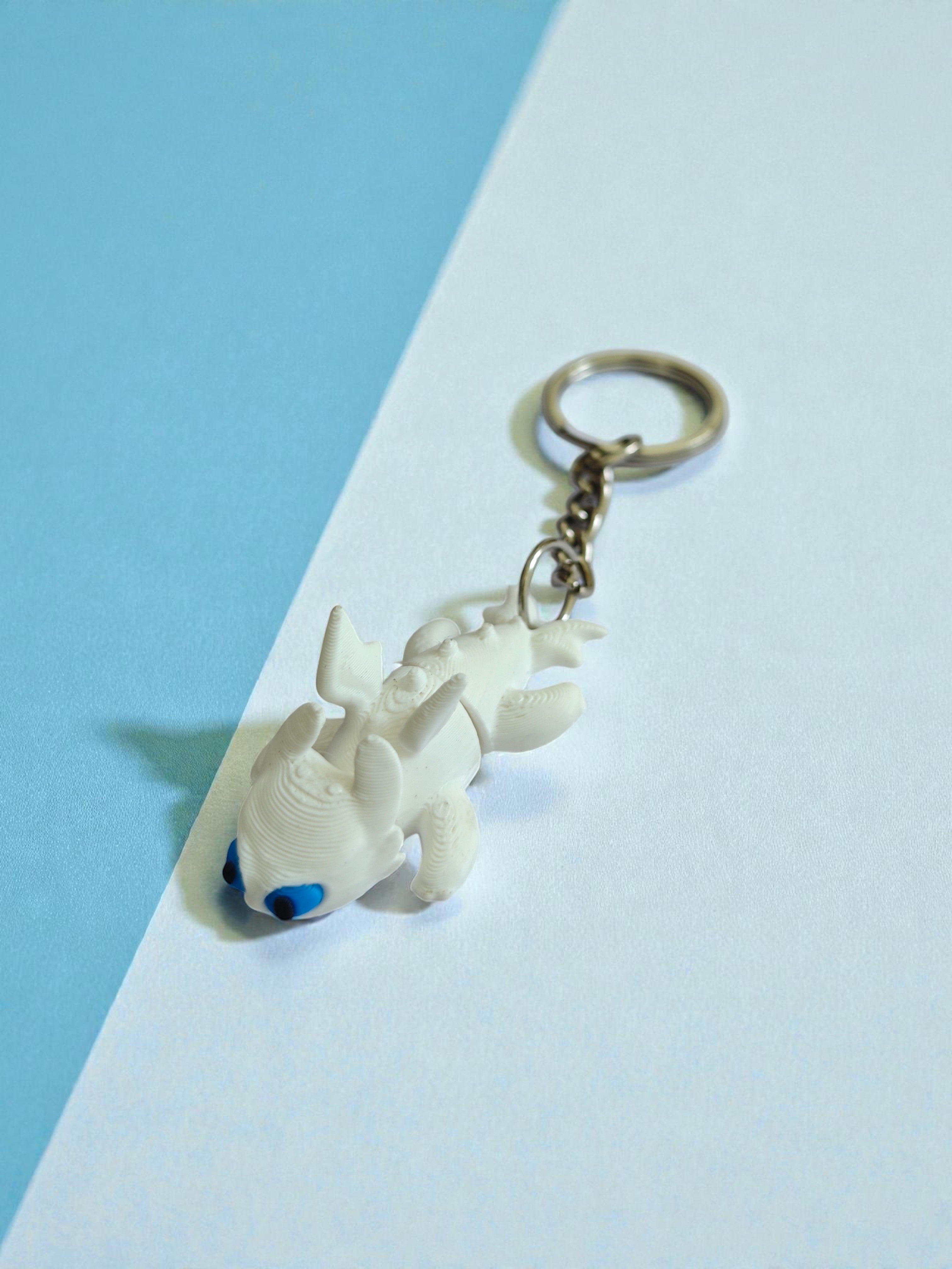 3D Printed flexi white toothless dragon keychain