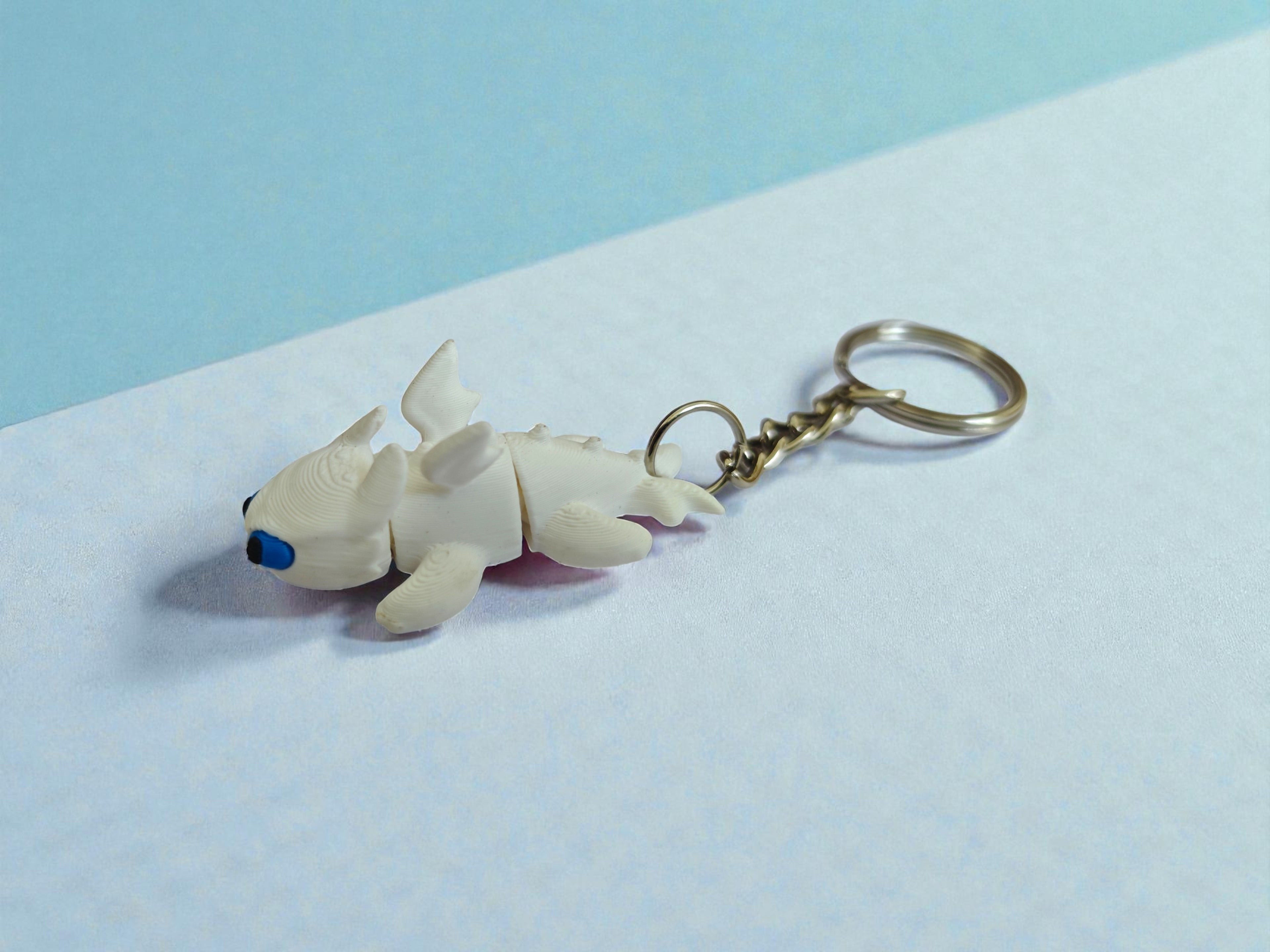3D Printed flexi white toothless dragon keychain