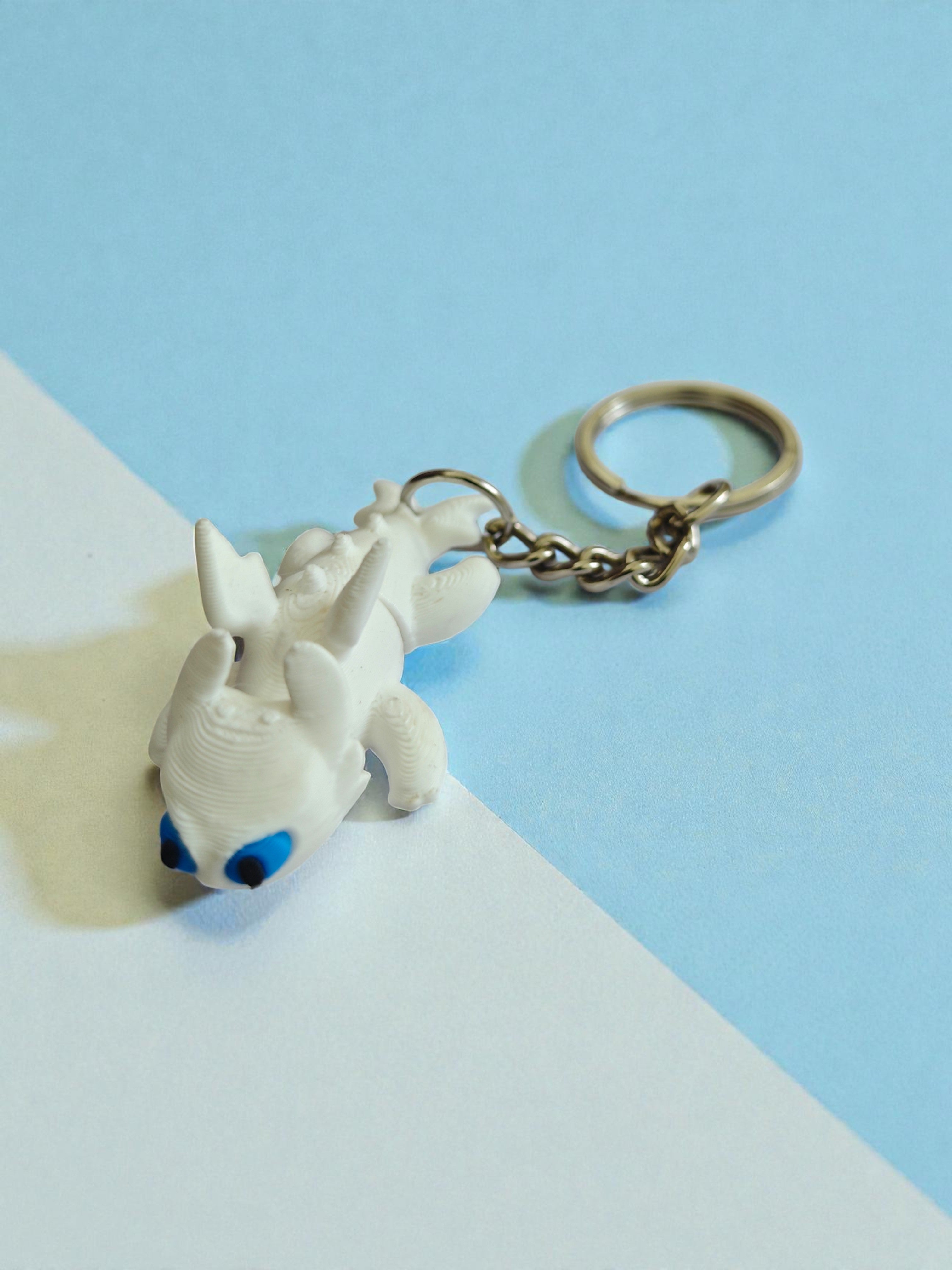 3D Printed flexi white toothless dragon keychain